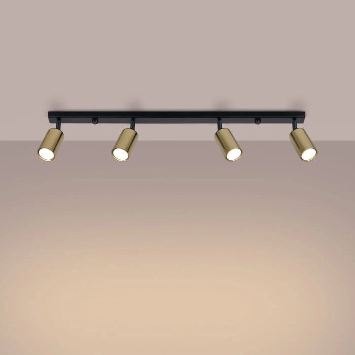 Luminaire plafonnier winx 4l noir avec quatre spots cylindriques dorés allie design moderne et fonctionnalité