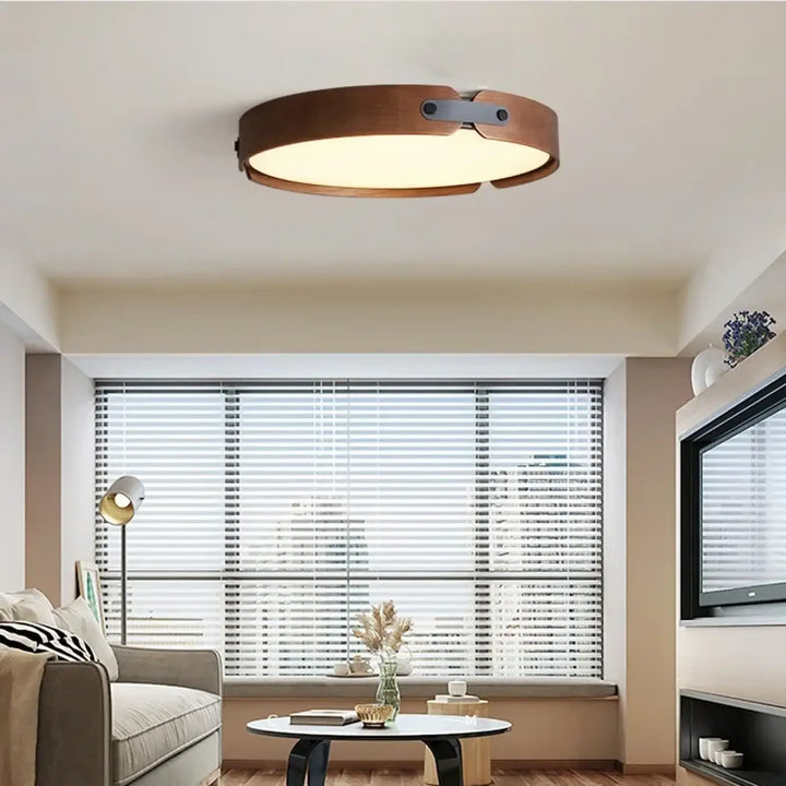 Luminaire plafonnier rond tanox avec finition bois chaleureux et détails inspirés en métal élégant