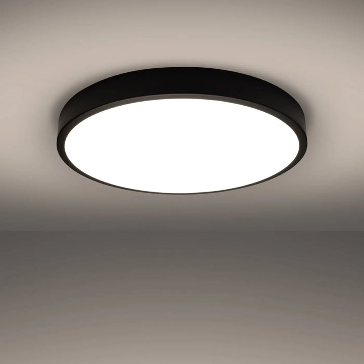 Luminaire plafonnier onyx 60 noir led 3000k plafond rond avec centre lumineux blanc pour recherche d’un éclairage moderne aux couleurs intemporelles