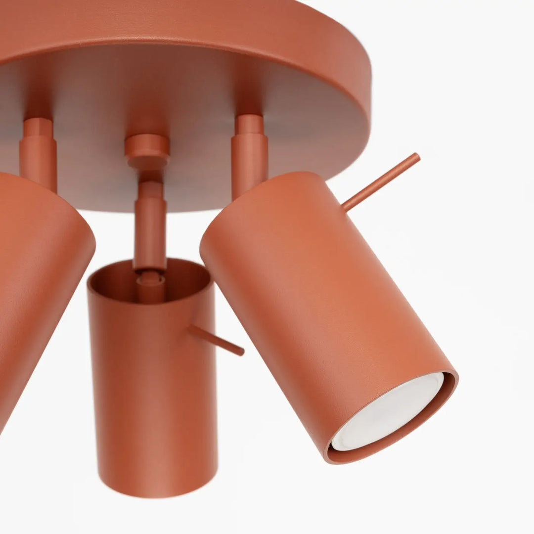 Luminaire plafonnier ring 3p rouge ochra avec lampe ring cylindrique terracotta à finition métal mat et éclairage flexible minimalisme moderne