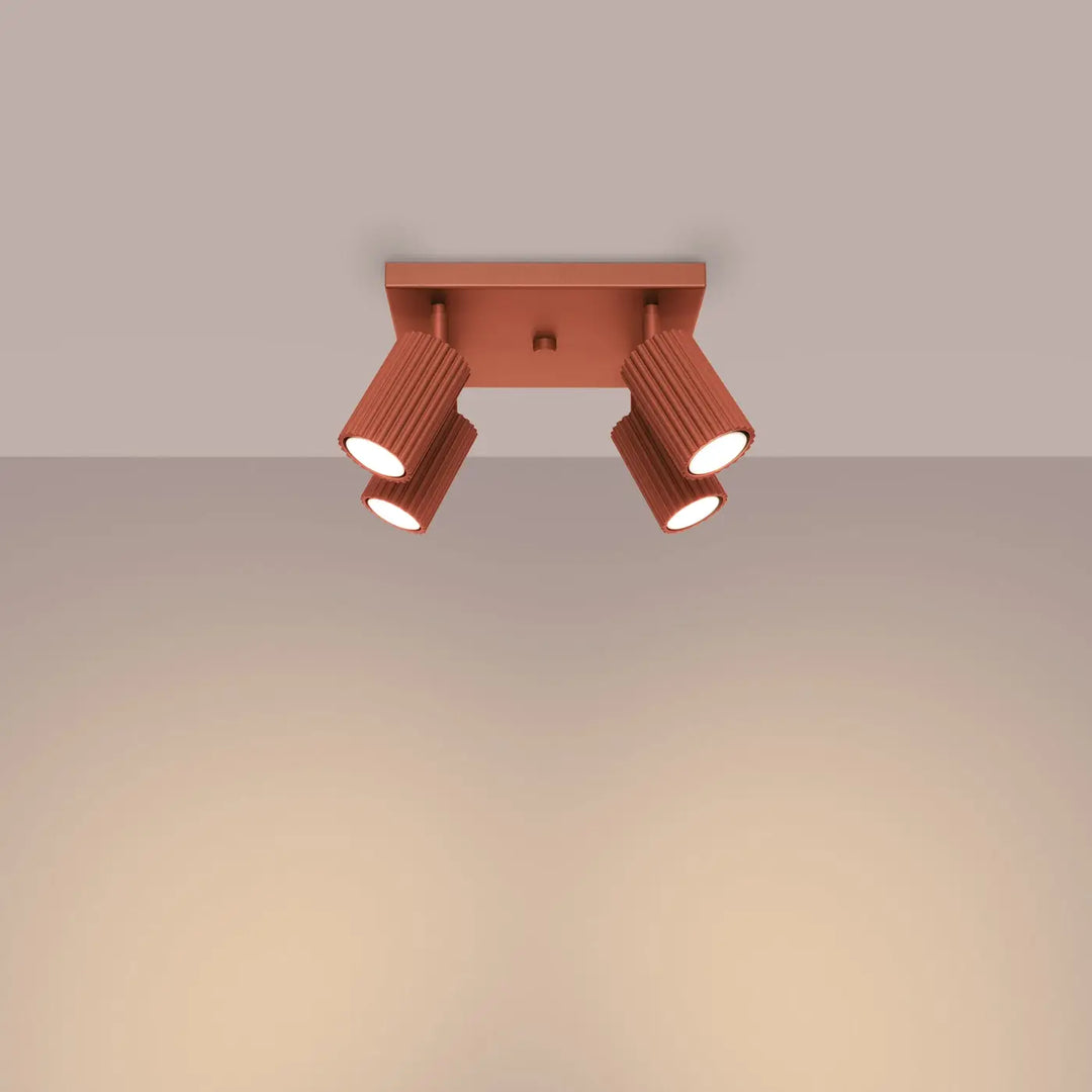 Plafonnier karbon cuivre avec quatre têtes cylindriques réglables et ampoules gu10 interchangeables design minimaliste