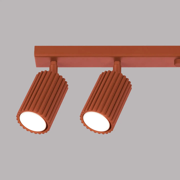 Plafonnier karbon 6l cuivre avec ampoules gu10 interchangeables design minimaliste et têtes cylindriques côtelées