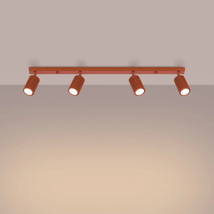 Plafonnier karbon allie cuivre avec quatre spots cylindriques nervurés et ampoules gu10 interchangeables style minimalisme