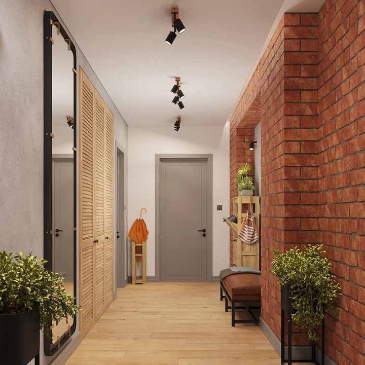 Le luminaire plafonnier fager 3 noir avec boîtier moderne éclaire un couloir orné d’un miroir noir à cadre élégant