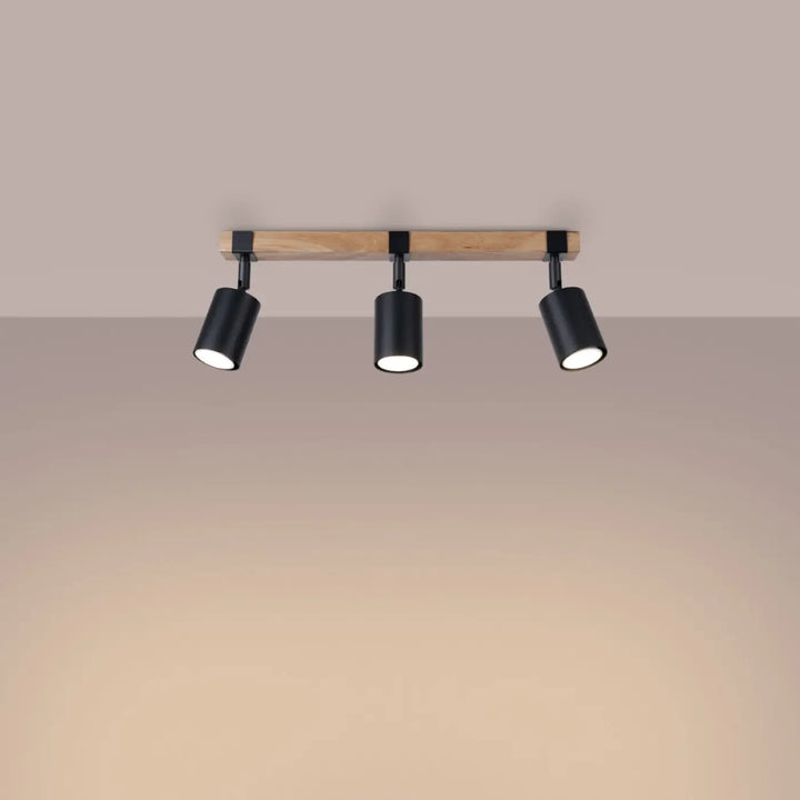 Luminaire plafonnier fager 3 noir avec lampe directionnelle fager en cylindre noir et boîtier moderne en bois clair