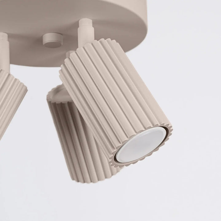 Plafonnier karbon allie design minimaliste en beige avec ampoules gu10 interchangeables et forme cylindrique nervurée