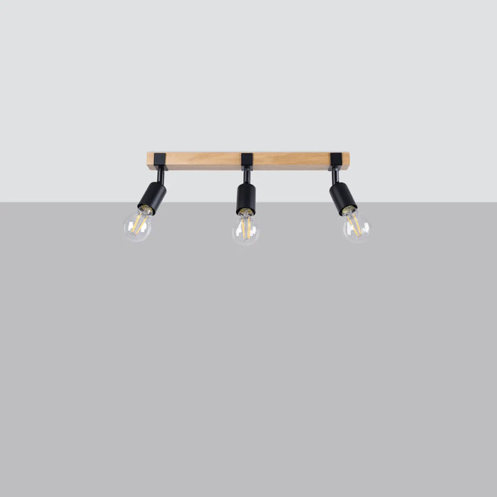 Luminaire plafonnier série zuca 3 noir avec barre en bois clair et ampoules décoratives visibles petites œuvres d’art