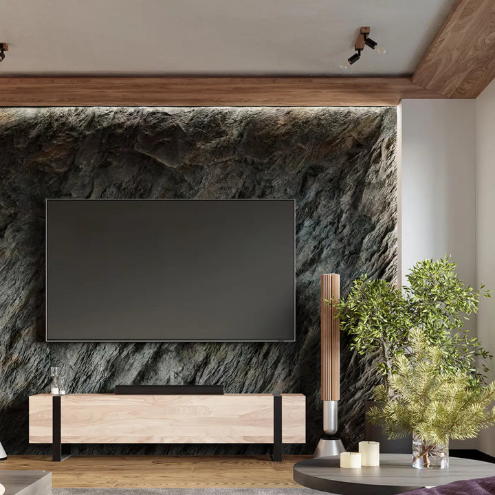Luminaire plafonnier série zuca 3 noir avec ampoules décoratives visibles sur mur en pierre texturée et console bois minimaliste