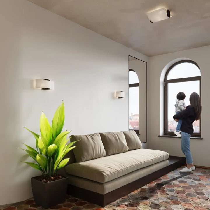 Luminaire plafonnier emilio avec canapé beige en tissu et structure en bois foncé pour un design intemporel