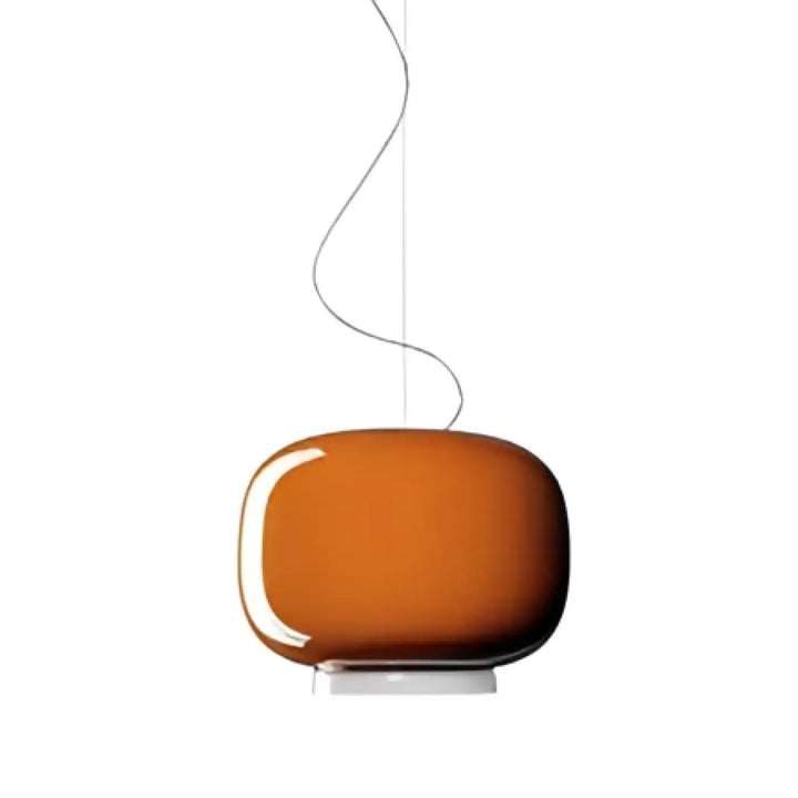Suspension luminaire aural en verre orange avec design arrondi et base blanche pour un luminaire moderne