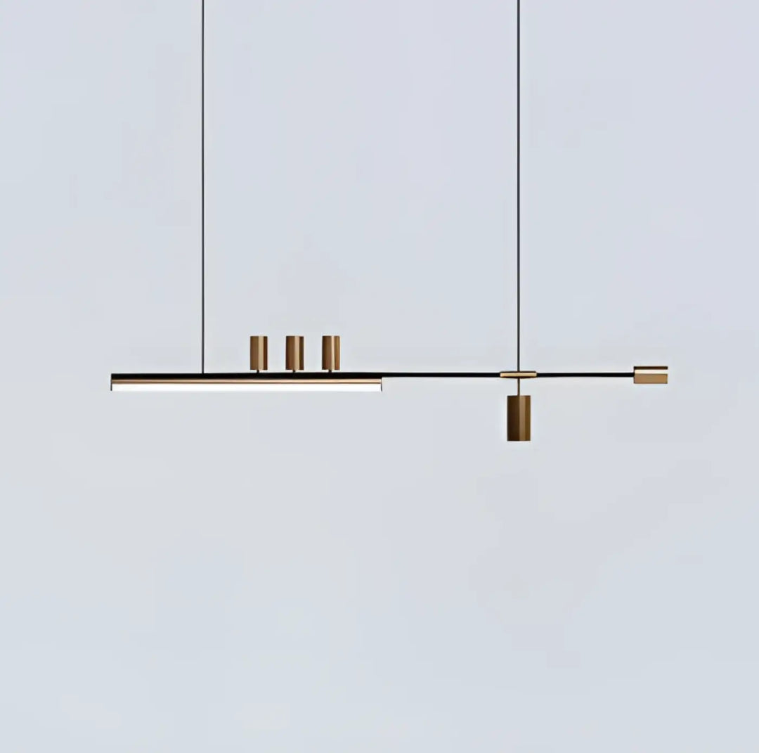 Suspension luminaire restih moderne minimaliste en barre noire avec quatre accents cylindriques en laiton suspendue par des cordons fins