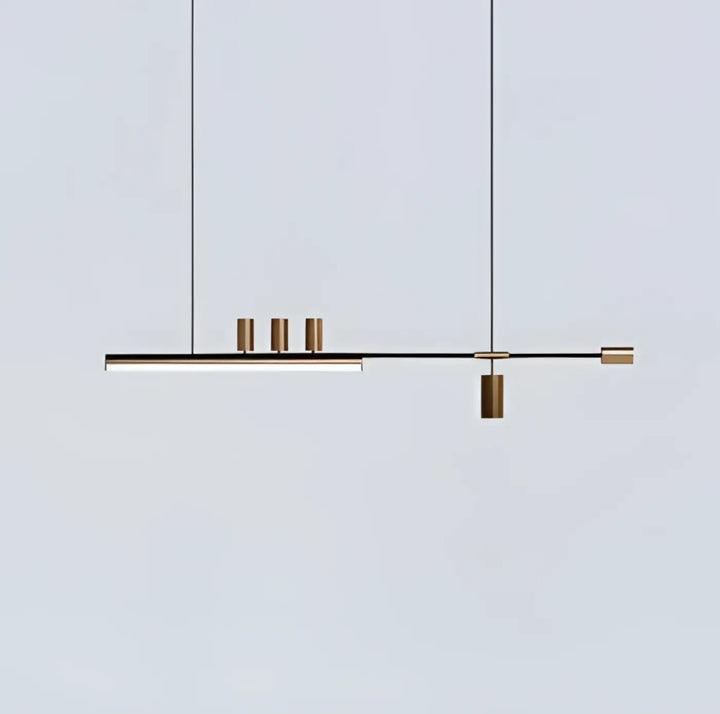 Suspension luminaire restih moderne minimaliste en barre noire avec quatre accents cylindriques en laiton suspendue par des cordons fins