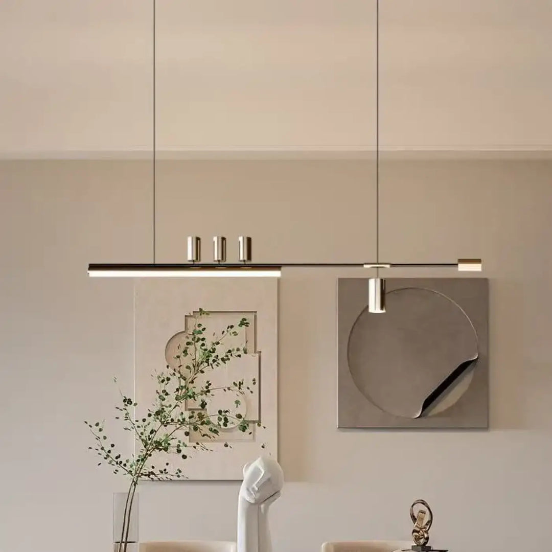 Suspension luminaire restih avec design linéaire minimaliste et trois accents cylindriques métalliques suspendus