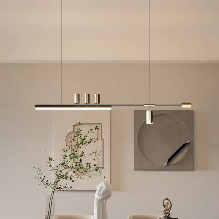 Suspension luminaire restih avec design linéaire minimaliste et trois accents cylindriques métalliques suspendus