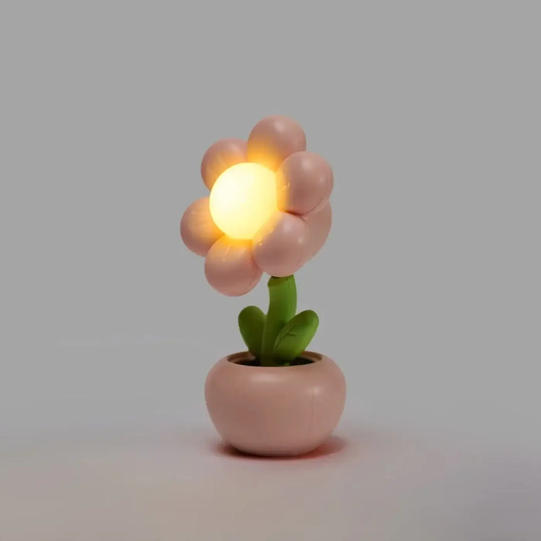 Veilleuse flower douce lumière douce en forme de fleur rose pastel avec centre jaune lumineux et pot décoratif vert