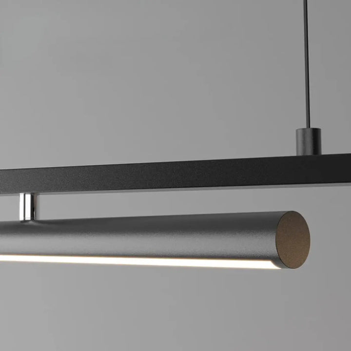 Suspension luminaire shap y moderne en métal brossé noir avec design cylindrique diffuse une lumière blanche chaude