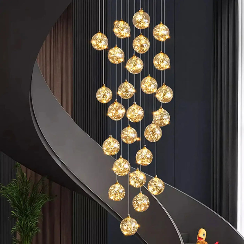 Plafonnier cascade moderne à LED dorées suspendues

