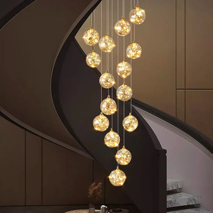 Plafonnier cascade moderne à LED dorées suspendues

