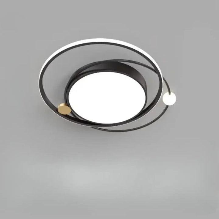 Luminaire plafonnier aloïs moderne avec design circulaire noir blanc et détails dorés pour lumière blanche ou chaude en salle à manger