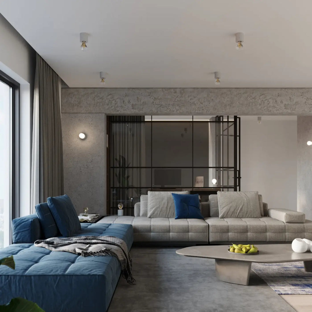 Modern canapé d’angle en tissu gris clair capitonné avec coussins bleu profond style loft l’applique murale salgado béton salgado