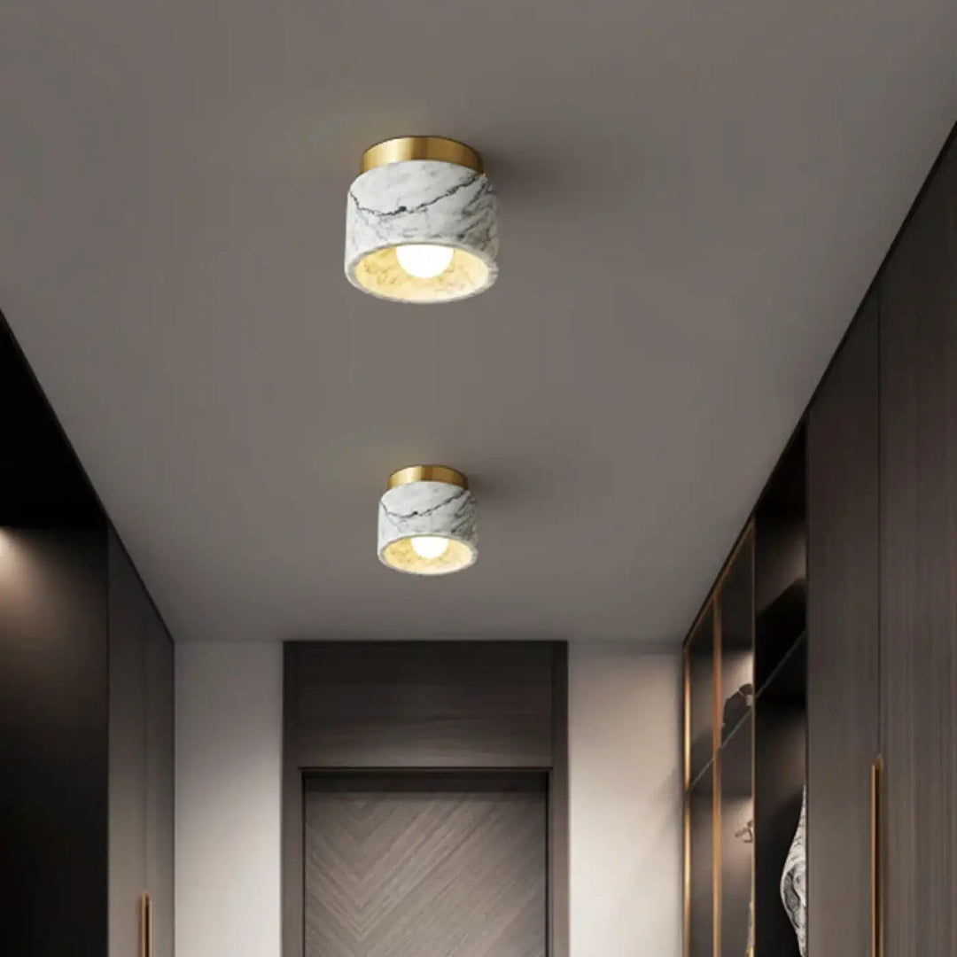 Plafonnier cylindre marbre élégant ambiance luxe blanc