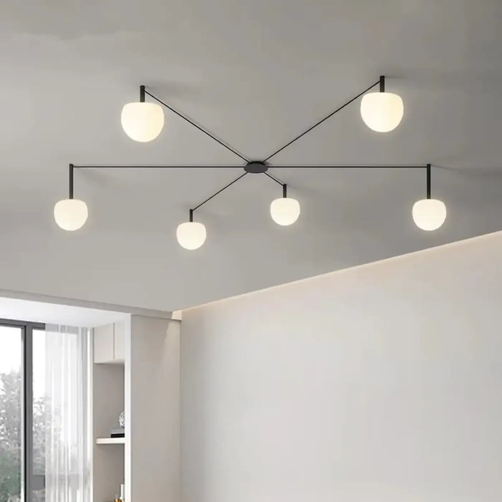 Plafonnier design aiko en métal noir moderne avec cinq globes en verre givré pour décoration intérieure univers déco
