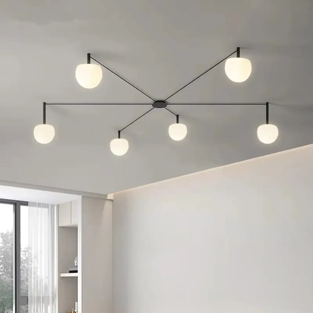 Plafonnier design aiko en métal noir moderne avec cinq globes en verre givré pour décoration intérieure univers déco