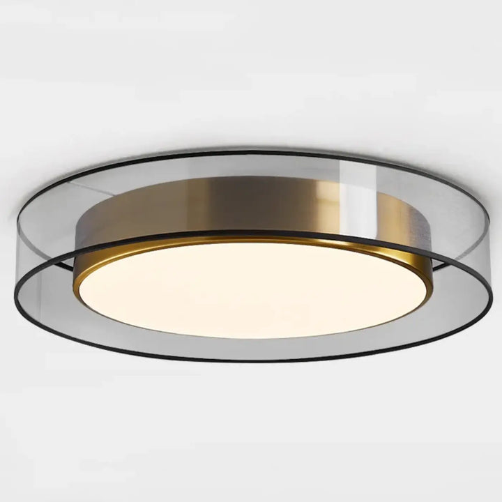 Luminaire plafonnier vadim avec anneau central or brossé, anneaux extérieurs en verre transparent et diffuseur blanc chaud éclairé