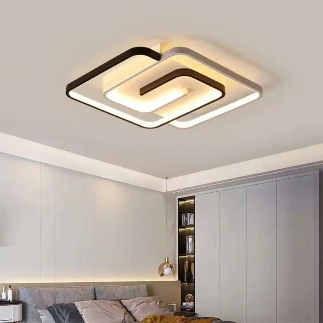 Plafonnier LED moderne mêlant formes carrées et spirale fluide

