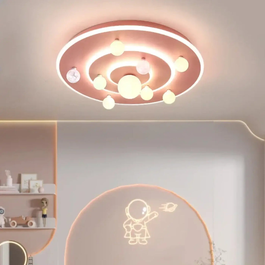 Plafonnier moderne univers galactique en rose gold avec anneaux concentriques et ampoules sphériques luminaire cosmi o