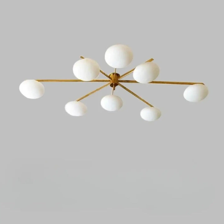 Plafonnier moderne xilys en ton or avec huit globes en verre blanc et bras graphiques en étoile