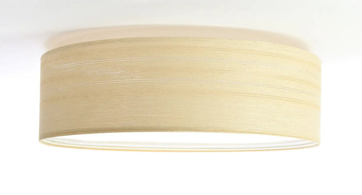 Plafonnier rond beige avec abat-jour en tissu crème texturé pour décoration intérieure élégante