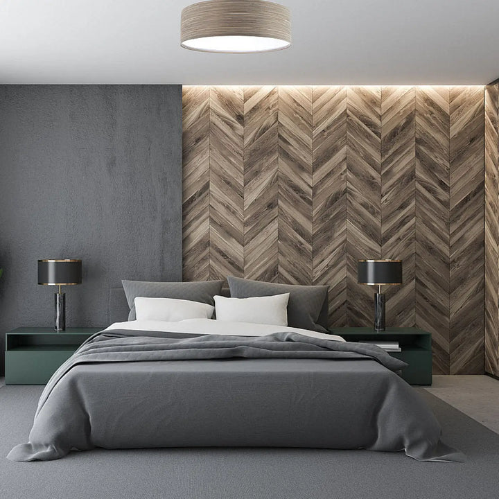 Luminaire plafonnier rond en tissu taupe avec dimension à l’éclairage moderne et design épuré sur un lit gris