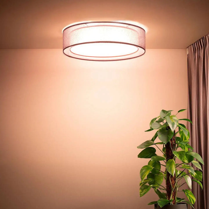 Luminaire plafonnier violet design rond avec abat-jour en tissu texturé et éclairage doux et chaleureux