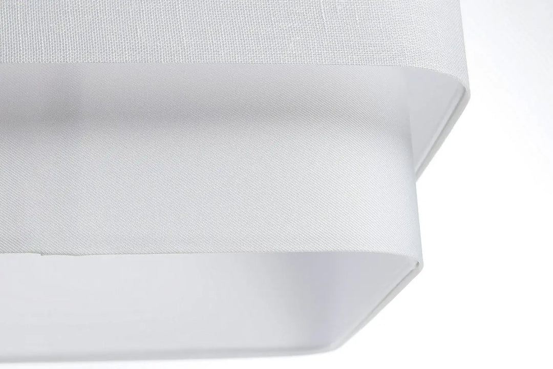 Suspension blanche design kwadro duo avec abat-jour en tissu blanc à texture tissée subtile et contours angulaires modernes