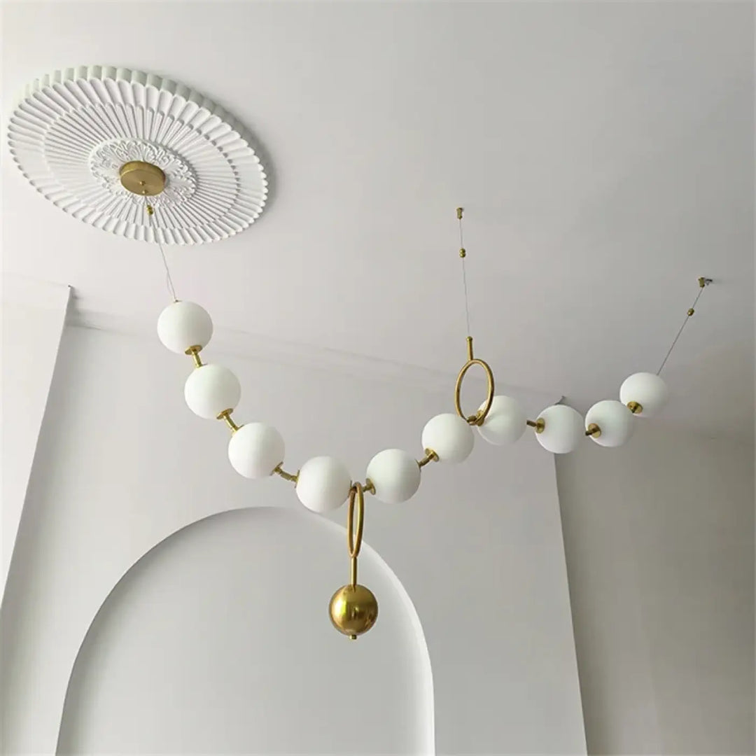 Suspension moderne boules lumineuses doré blanc raffiné