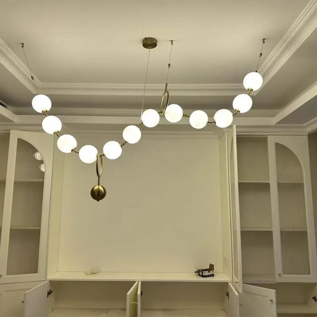 Suspension moderne boules lumineuses doré blanc raffiné