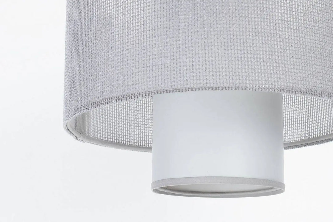 Suspension grise double avec abat-jour en tissu tissé gris et base cylindrique blanche lisse