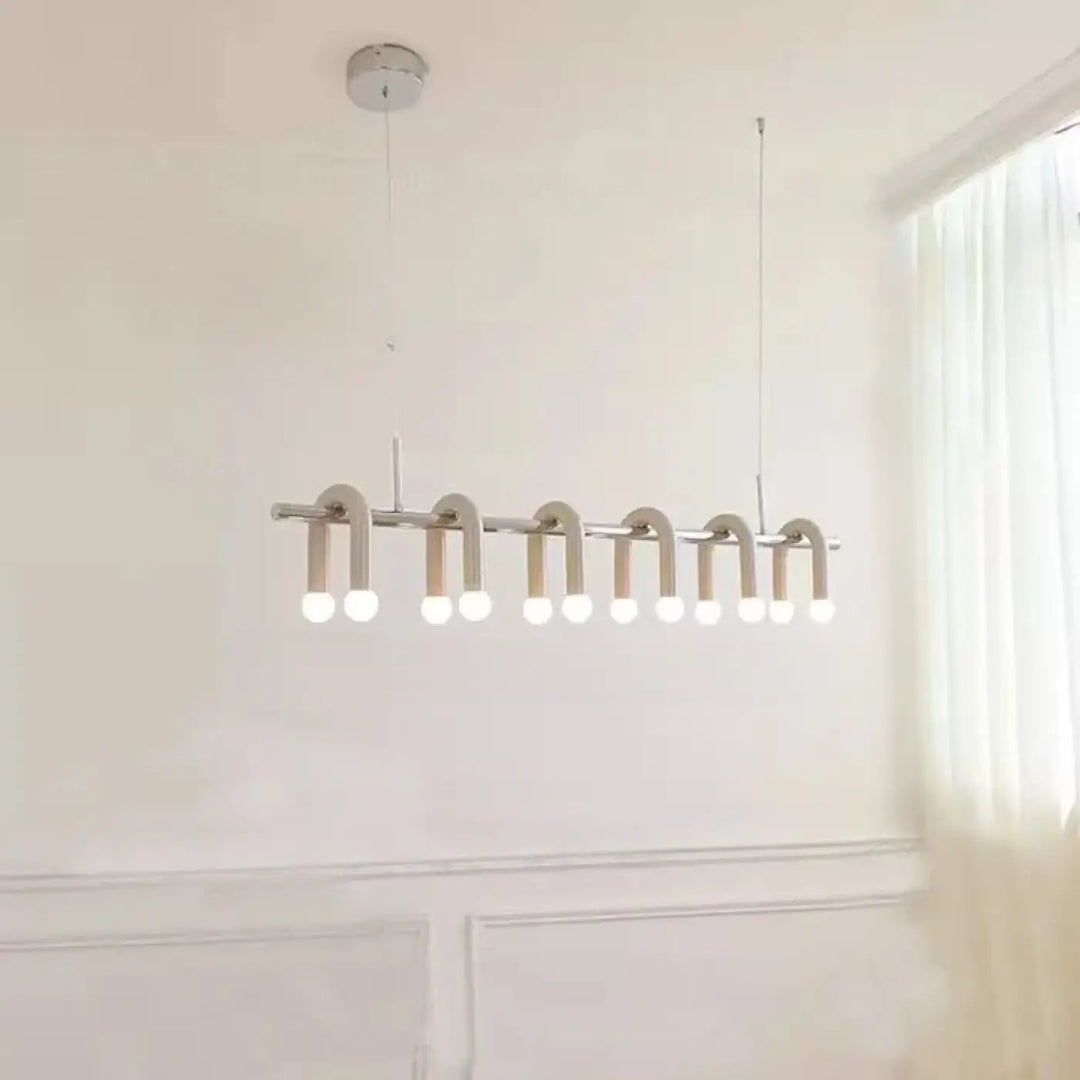 Suspension luminaire archis moderne minimaliste en chrome avec dix leds blanc chaud disposées en ligne courbée élégante