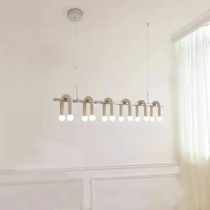 Suspension luminaire archis moderne minimaliste en chrome avec dix leds blanc chaud disposées en ligne courbée élégante