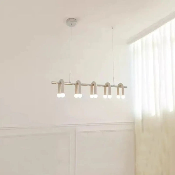 Suspension luminaire moderne minimaliste avec cinq bras métalliques courbés et ampoules led blanc chaud