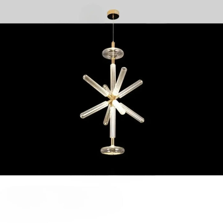Suspension luminaire striel moderne avec bras en verre cannelé clair et accents métalliques dorés esthétique artistique