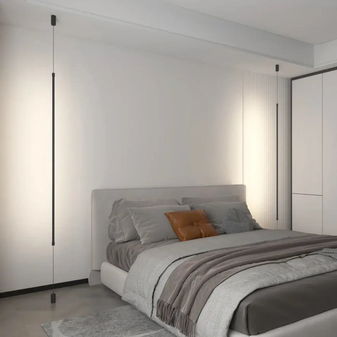 Suspension luminaire attachée au plafond au sol par une barre LED

