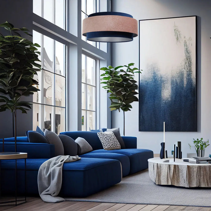 Vibrant bleu marine sectional sofa with plush cushions and rose pâle suspension luminaire in doblo classic design