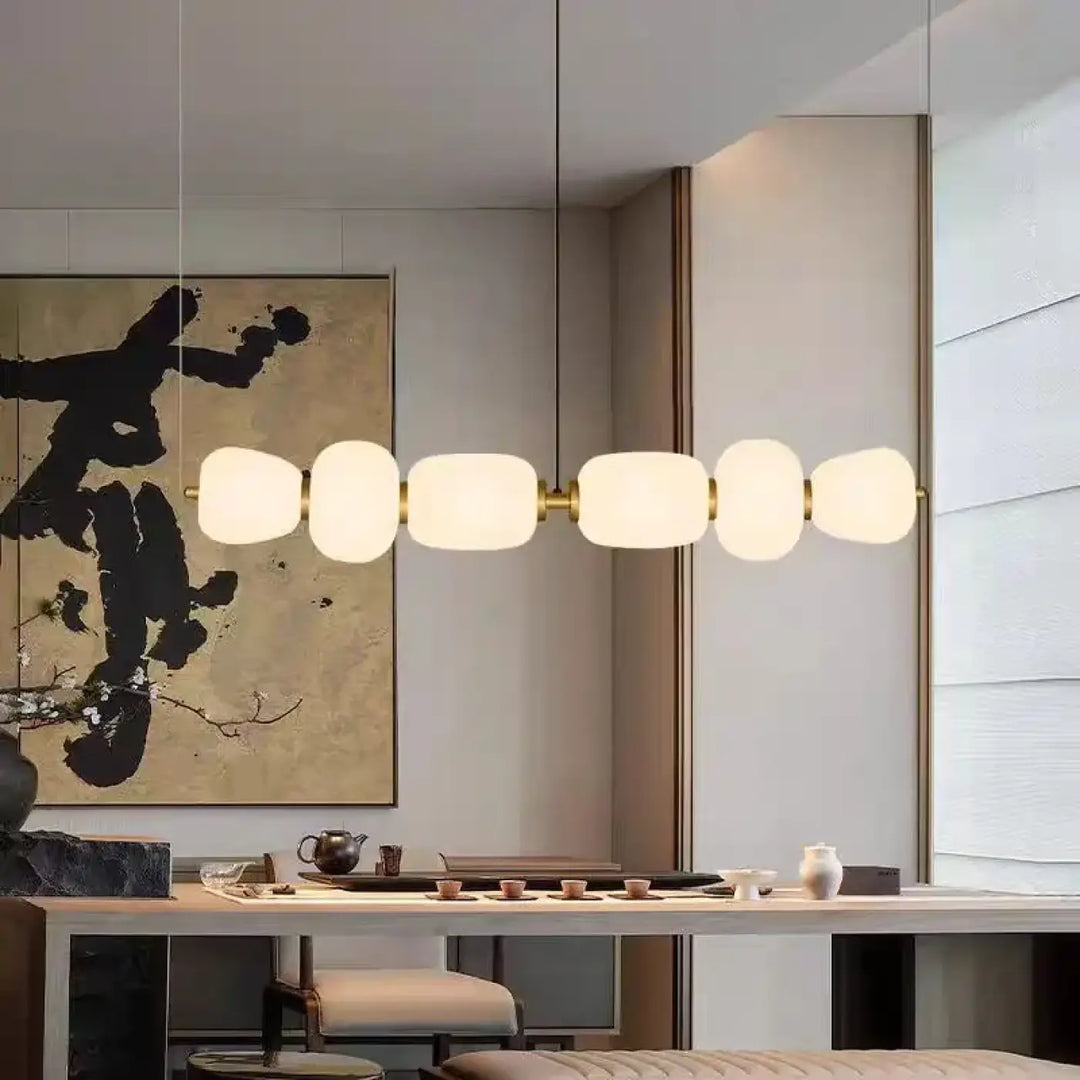 Suspension luminaire avec boules en verre et support en laiton chic