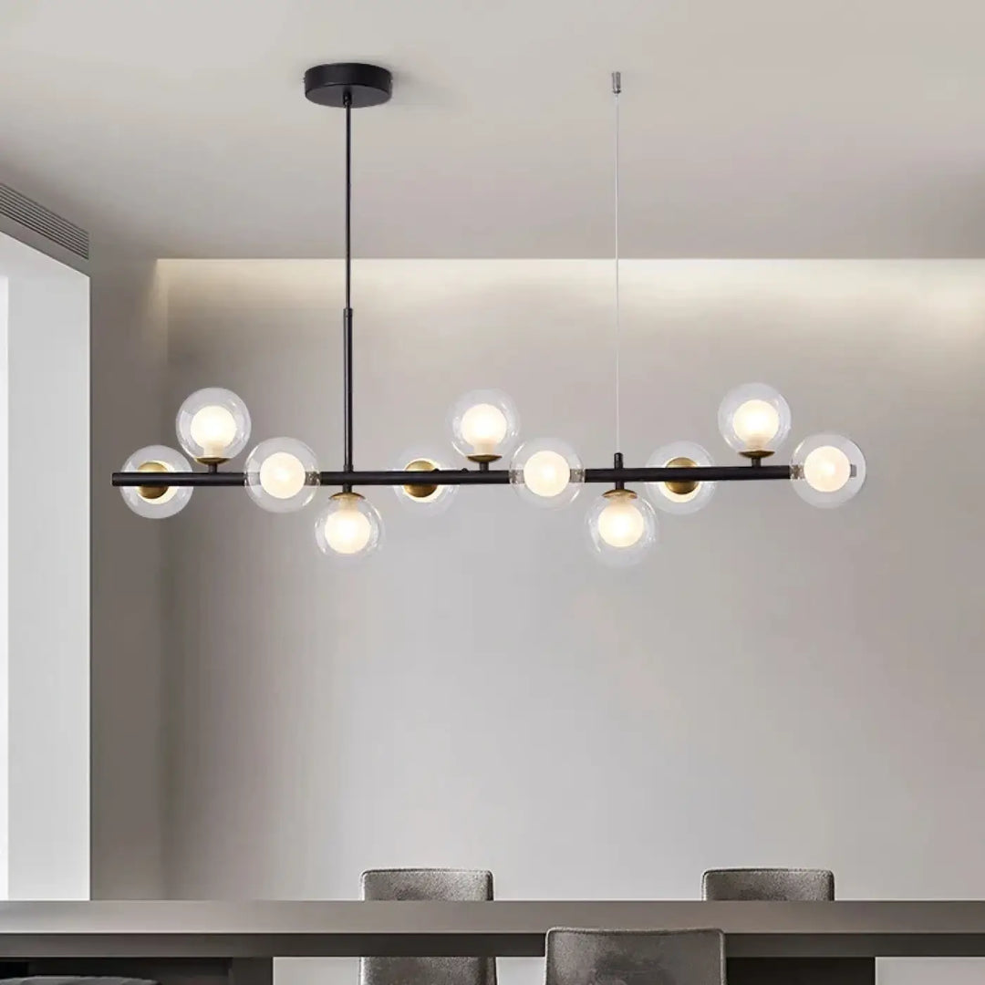 Suspension luminaire à boules de verre teinté sur un support noir

