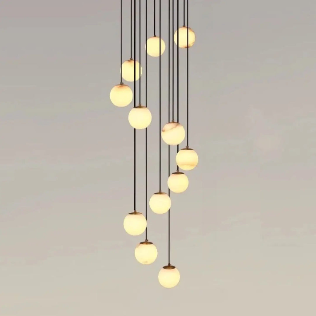 Suspension luminaire souble avec suspension design boules en verre marbré chic couleur crème chaude style univers art déco