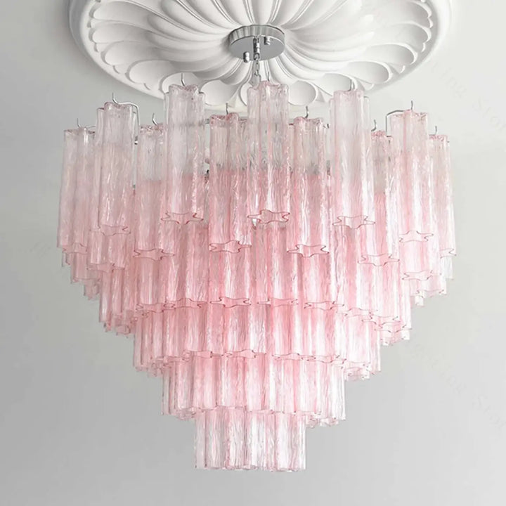 Suspension luminaire rosila avec tubes en verre rose translucide texturés et découpes étoiles pour un luminaire chic