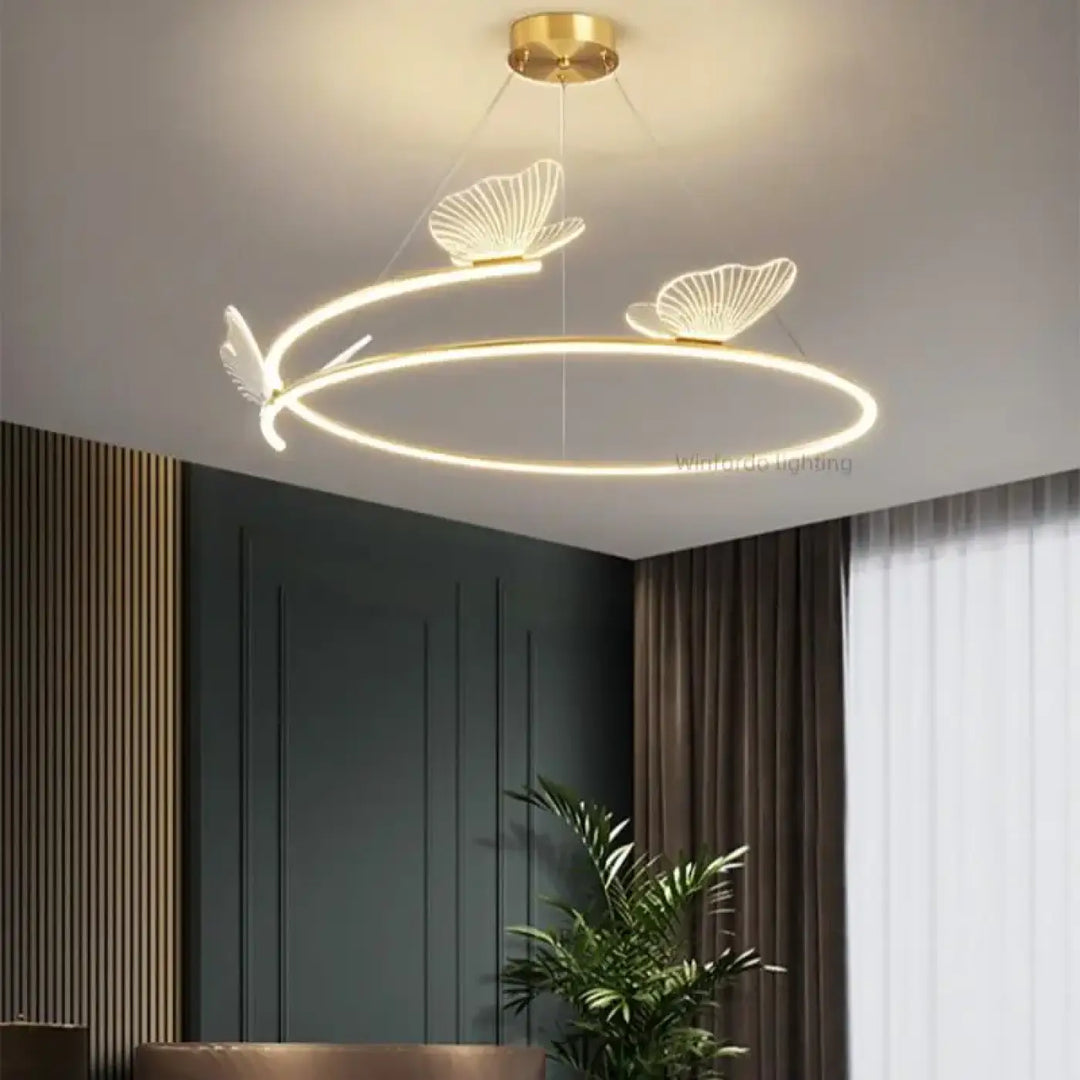 Suspension luminaire circulaire LED avec 3 papillons dorés

