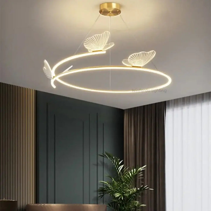 Suspension luminaire circulaire LED avec 3 papillons dorés


